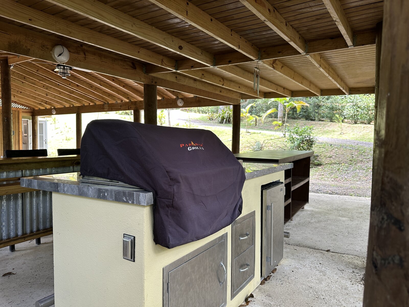 Built-in Paradise Grills BBQ station with stainless cabinets at Batey Zumbador