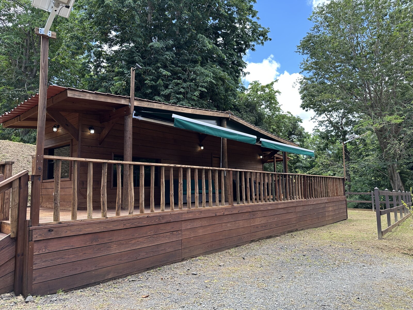Casa Bambú exterior with wraparound wooden deck at Hacienda Yuké